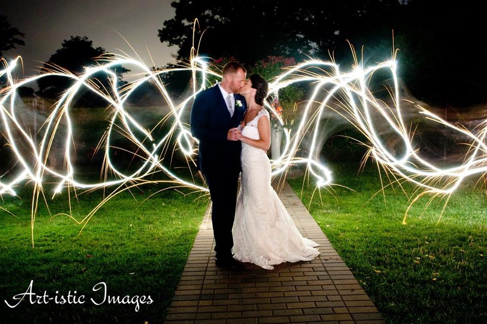 bride and groom in romantic setting with abstract lights